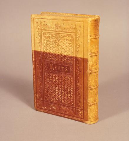Leather bound book of Keats’ poems showing fading to the leather due to light exposure.