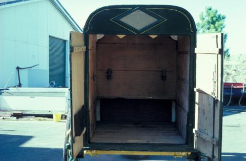 The interior of the cart, showing its worn condition from years of use.