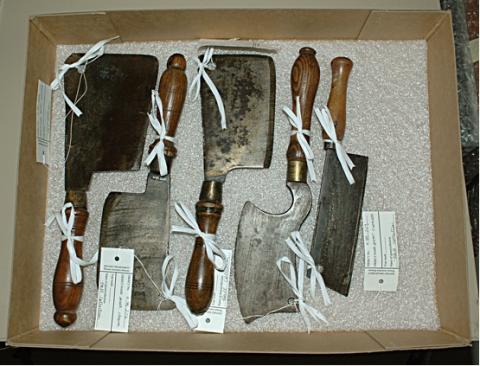 Multiple knives tied onto a base of Cell-Aire with room for an additional object of the same classification.